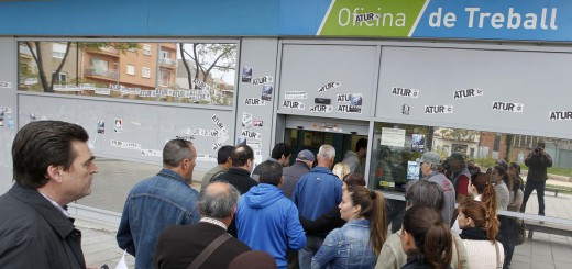 People line up at an employment office in Badalona