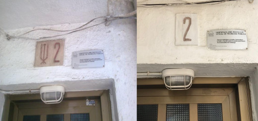 Una de les plaques franquistes que hi havia als pisos de Sant Quirze, actualment retirades.